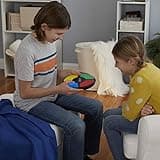 Hasbro Simon, Juego de Memoria Electrónico portátil con Sonidos y Luces para Mayores de 8 años, Color Surtido